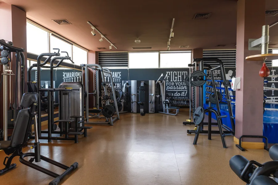 A row of strength machines in the gym